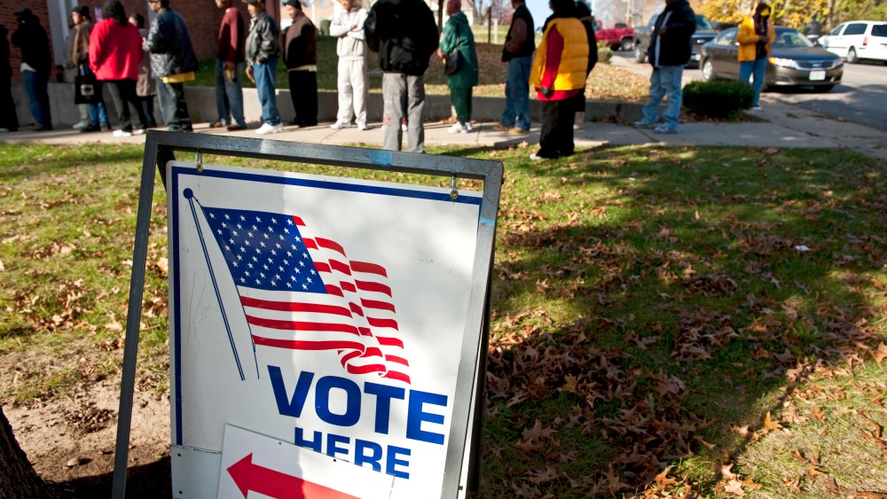 Voters wait in line to cast their vote at Mount Pleasant Baptist Church on November 6, 2012 in Kansas City, Missouri.