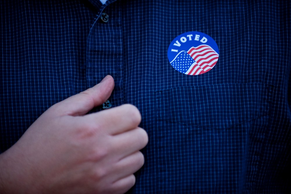A man proudly displays his "I Voted" sticker at the Country Club Congregational Church on Nov. 6, 2012 in Kansas City, Mo.