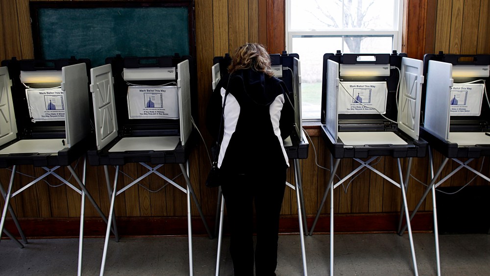 A woman casts her vote at a polling station on Nov. 6, 2012 in Sugar Creek, Wisconsin.
