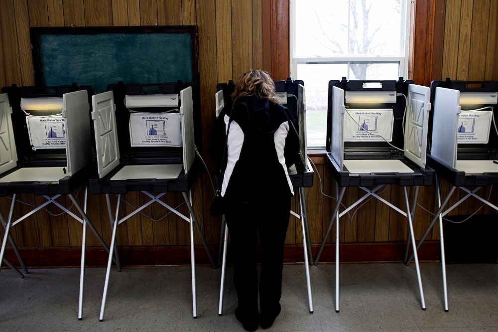 A woman casts her vote at a polling station on Nov. 6, 2012 in Sugar Creek, Wisconsin.