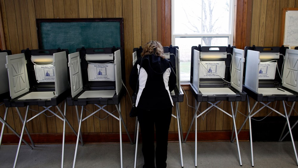A woman casts her vote at a polling station on Nov. 6, 2012 in Sugar Creek, Wis.