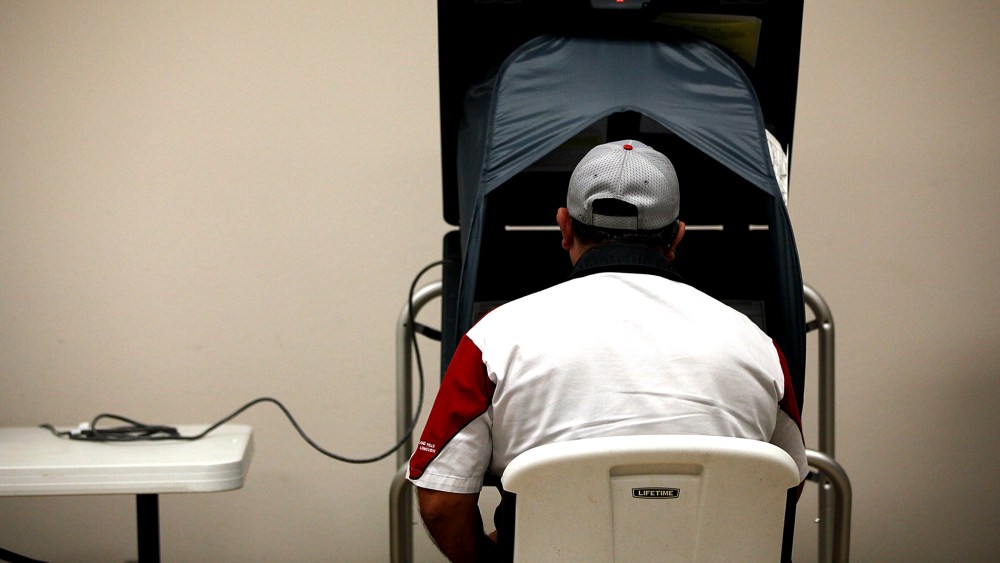 A voter casts an electronic ballot, Nov. 6, 2012 in Fort Worth, Texas.