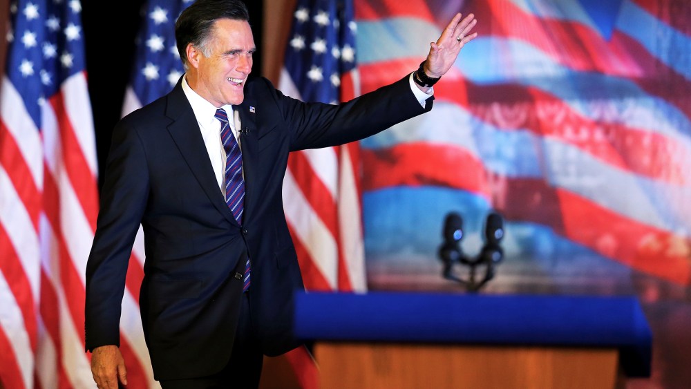 Mitt Romney waves to the crowd before conceding the presidency on November 7, 2012 in Boston, Massachusetts.