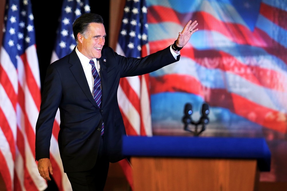 Mitt Romney waves to the crowd before conceding the presidency on November 7, 2012 in Boston, Massachusetts.