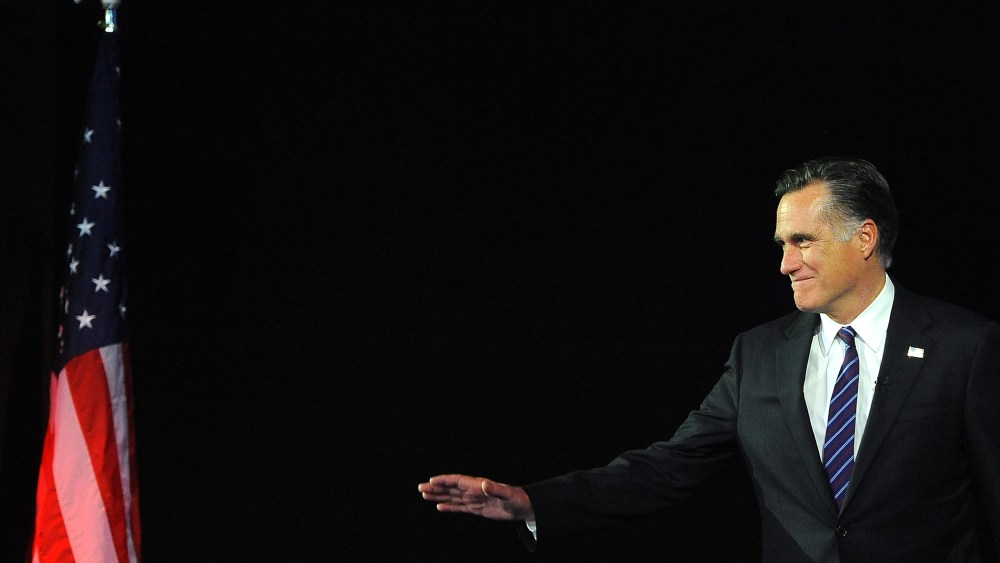 Then, Republican presidential candidate Mitt Romney arrives on stage on Nov. 7, 2012 in Boston, Mass. (Photo by Emmanuel Dunand/AFP/Getty)
