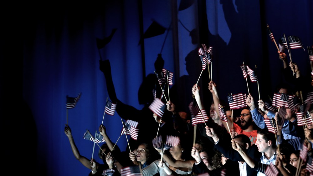 Supporters cheer as U.S. President Barack Obama delivers his victory speech after being reelected for a second term