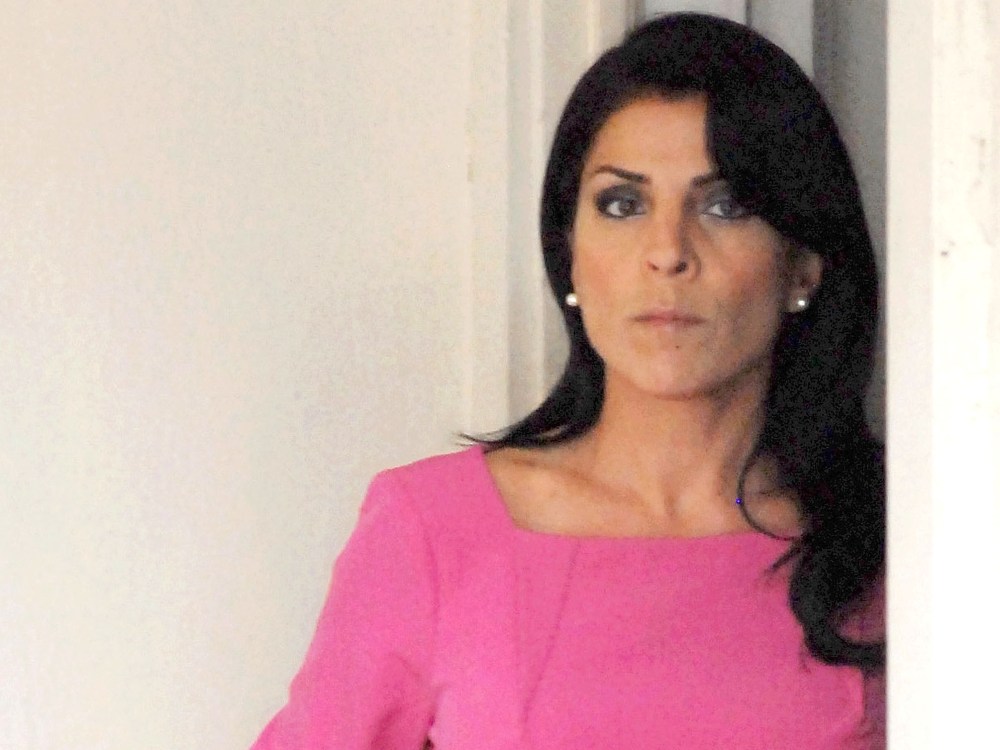 Jill Kelley leaves her home on November 13 in Tampa, Fla. Kelley reported receiving harassing emails to the FBI, which resulted in an investigation that revealed an affair between Paula Broadwell and CIA Director David Petraeus. (Photo by Tim Boyles...