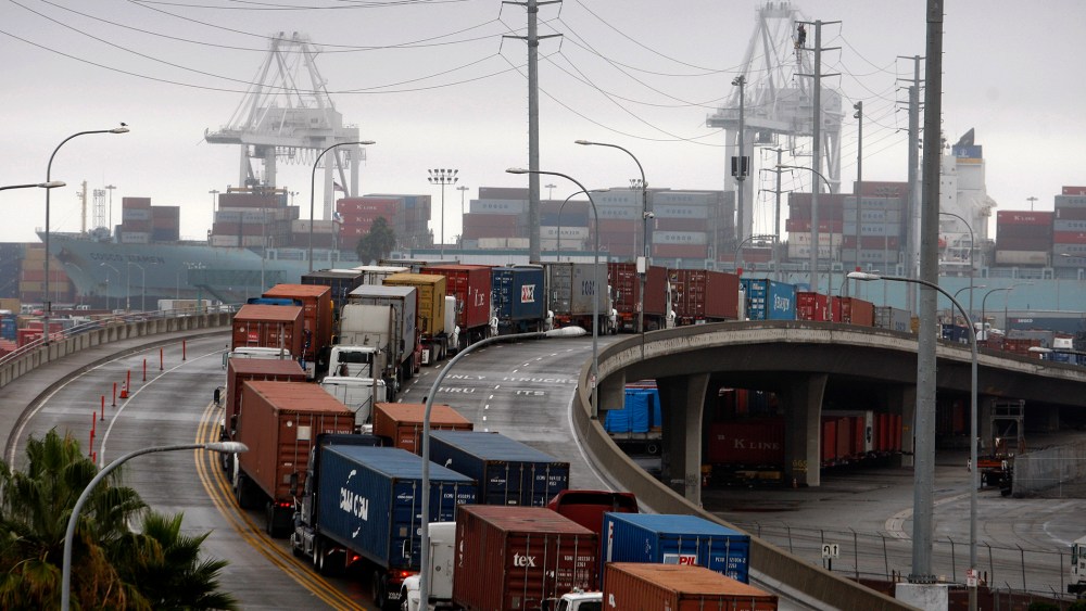 Shipping container trucks sit in traffic at the seaport, Nov.  29, 2012 in Long Beach, Calif.
