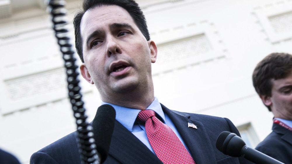 Wisconsin Governor Scott Walker speaks with reporters after a meeting at the White House, Dec. 4, 2012.