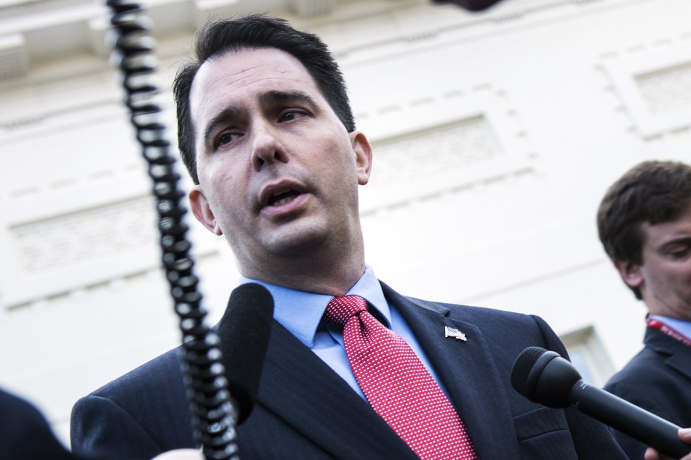 Wisconsin Governor Scott Walker speaks with reporters after a meeting at the White House, Dec. 4, 2012.