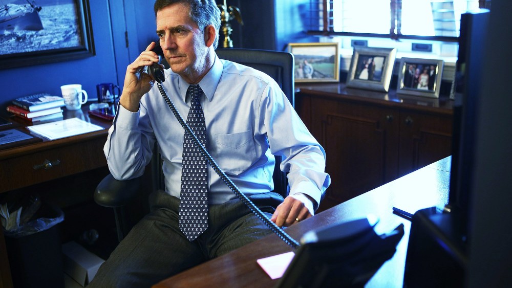 U.S. Senator Jim DeMint talks on the phone in his office December 6, 2012 on Capitol Hill in Washington, DC.