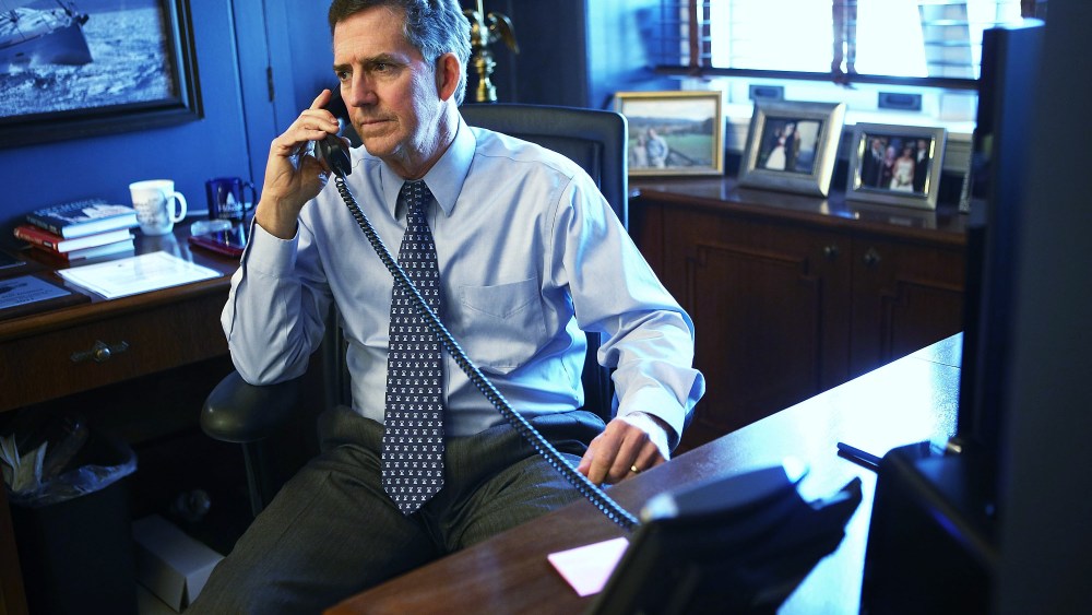 U.S. Senator Jim DeMint (R-SC) talks on the phone in his office December 6, 2012 on Capitol Hill in Washington, DC.