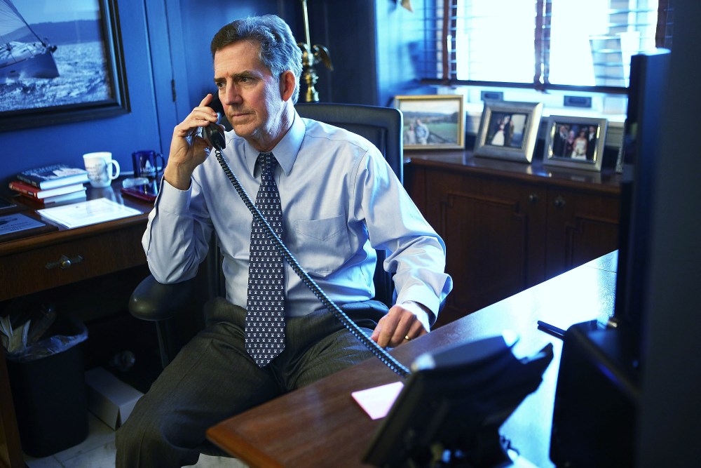 U.S. Senator Jim DeMint (R-SC) talks on the phone in his office December 6, 2012 on Capitol Hill in Washington, DC.