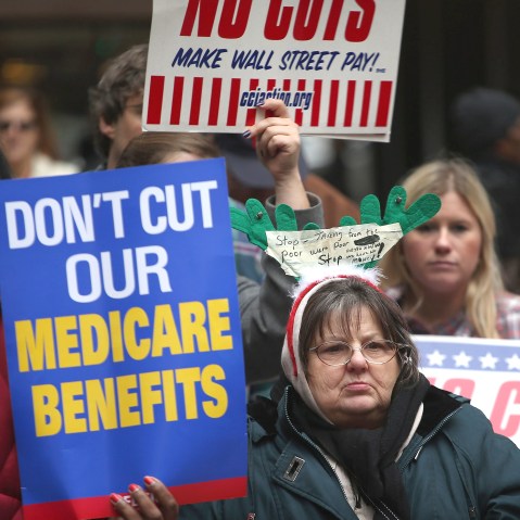 Protestors call for an increase of taxes on the wealthy and voice opposition to cuts in Social Security, Medicare, and Medicaid during a demonstration in the Federal Building Plaza on December 6, 2012 in Chicago, Illinois.  About 300 protestors...