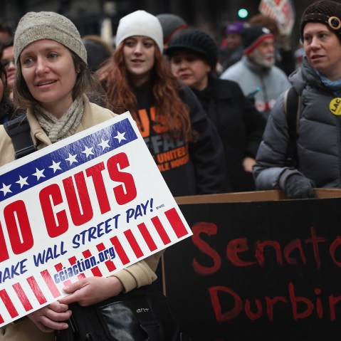 Protestors call for an increase of taxes on the wealthy and voice opposition to cuts in Social Security, Medicare, and Medicaid during a demonstration in the Federal Building Plaza on December 6, 2012 in Chicago, Illinois.  About 300 protestors...