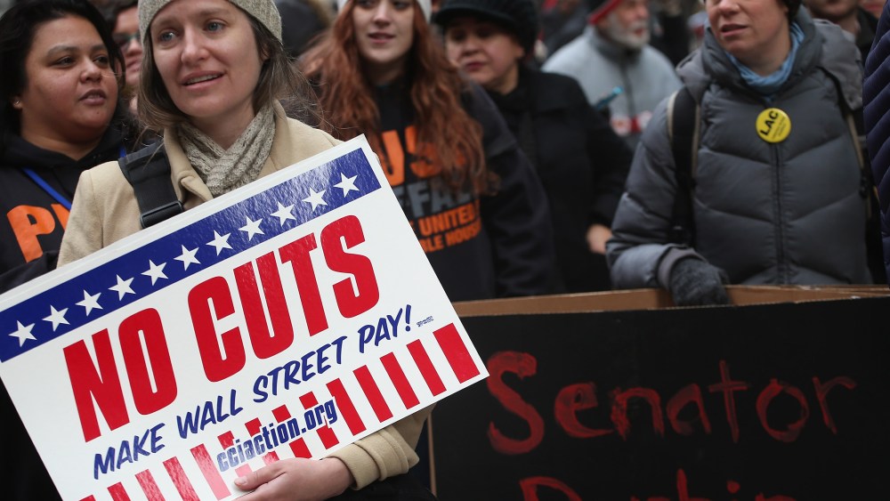 Protestors call for an increase of taxes on the wealthy and voice opposition to cuts in Social Security, Medicare, and Medicaid during a demonstration in the Federal Building Plaza on December 6, 2012 in Chicago, Illinois.  About 300 protestors...