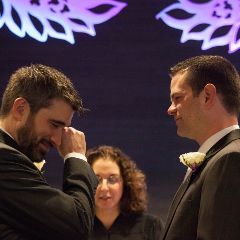 Steven Austin and Michael Pirkle during their wedding at City Hall on December 9, 2012 in Seattle, Washington--the first day that same-sex couples could legally wed in the state. The two have been together for 12 years. (Photo by David Ryder/Getty Images)