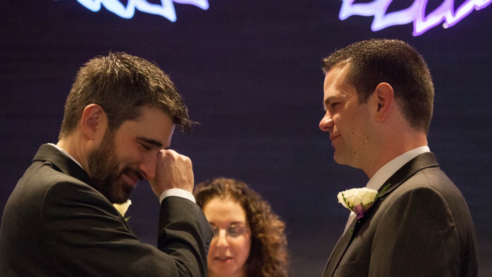 Steven Austin and Michael Pirkle during their wedding at City Hall on December 9, 2012 in Seattle, Washington--the first day that same-sex couples could legally wed in the state. The two have been together for 12 years. (Photo by David Ryder/Getty Images)