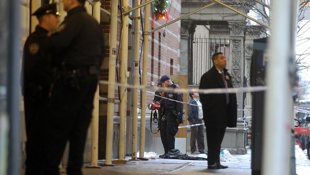 Police investigate the scene of a fatal shooting at 202 West 58th Street in Manhattan on Dec. 10, 2012 in New York City.