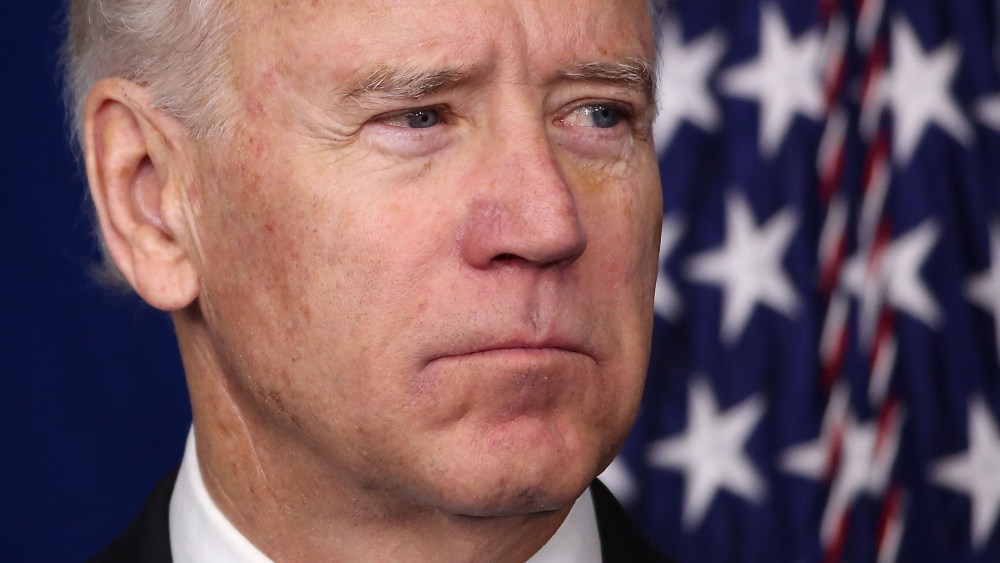 Vice President Biden listens as President Obama speaks during an announcement on gun reform in the Brady Press Briefing Room of the White House December 19, 2012 in Washington, DC.  (Photo by Win McNamee/Getty Images)