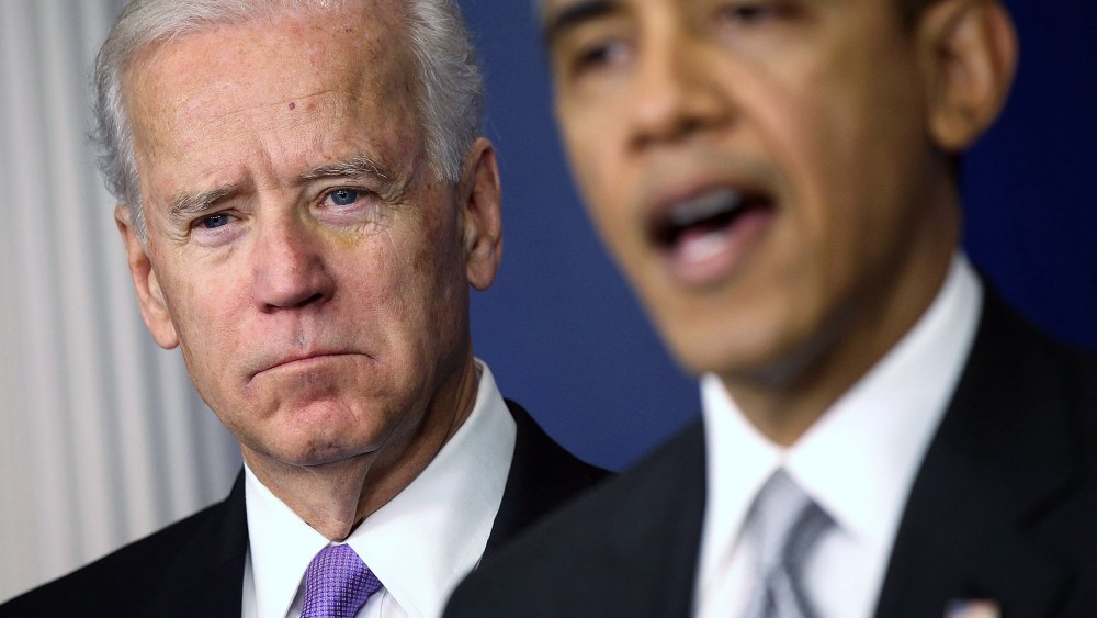 U.S. Vice President Joseph Biden (L) listens as U.S. President Barack Obama speaks during an announcement on gun reform in the Brady Press Briefing Room of the White House December 19, 2012 in Washington, DC. President Obama announced that he is making...