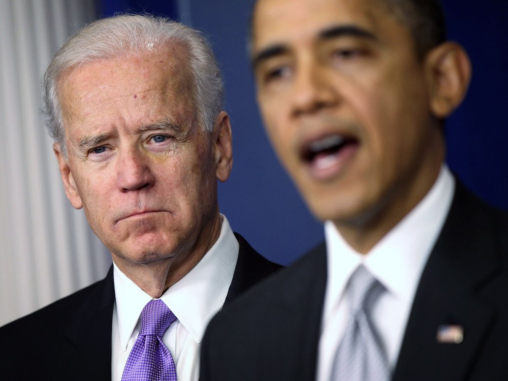 U.S. Vice President Joseph Biden (L) listens as U.S. President Barack Obama speaks during an announcement on gun reform in the Brady Press Briefing Room of the White House December 19, 2012 in Washington, DC. President Obama announced that he is making...