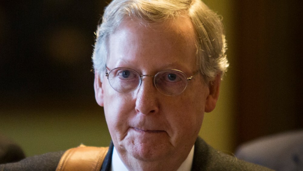 File Photo: Senate Minority Leader Mitch McConnell (R-KY) walks to his office on Capitol Hill December 31, 2012 in Washington, DC. The House and Senate are both still in session on New Year's Eve to try to deal with the looming 'fiscal cliff.' (Photo...