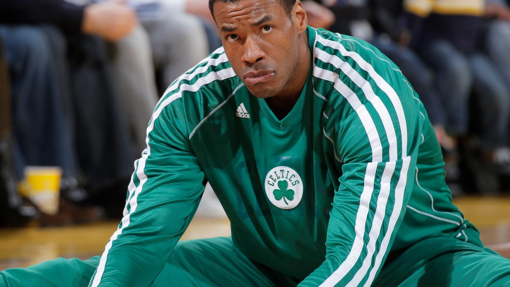 Jason Collins #98 of the Boston Celtics warms up in a game against the Golden State Warriors on December 29, 2012 at Oracle Arena in Oakland, California. (Photo by Rocky Widner/NBAE via Getty Images)