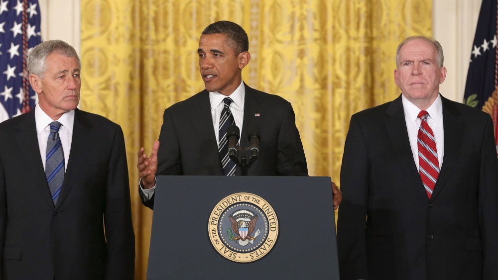 U.S. President Barack Obama (C) speaks during a news conference with chief counterterrorism adviser John Brennan (L), and former U.S. Sen. Chuck Hagel (R-NB) in the East Room at the White House on January 7, 2013 in Washington, DC. Pending approval by...