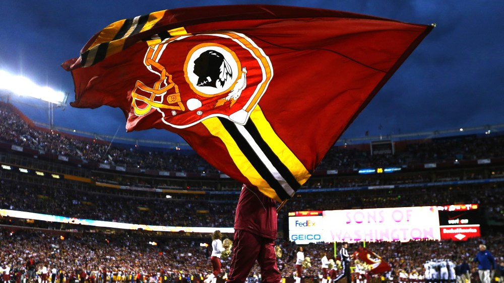 A Washington Redskins flag is waved prior to the NFC Wild Card Playoff Game