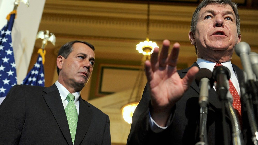 Rep. Roy Blunt (R-MO) and House Minority Leader John Boehner (R-OH) speak to reporters on Capitol Hill in Washington, October 3, 2008.