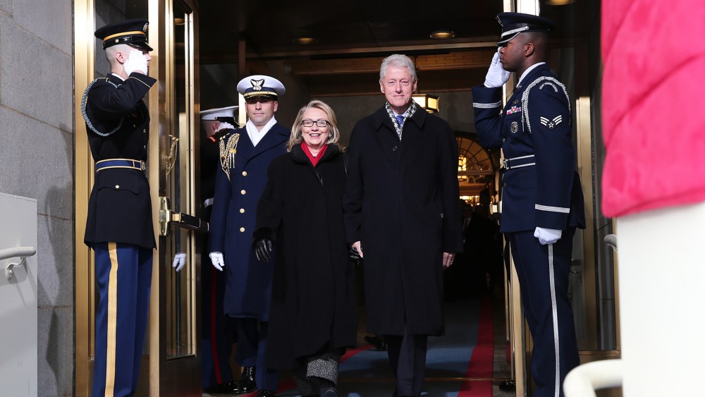 Secretary of State Hillary Clinton and former President Bill Clinton arrive during the presidential inauguration on the West Front of the U.S. Capitol, Jan. 21, 2013, in Washington, D.C.