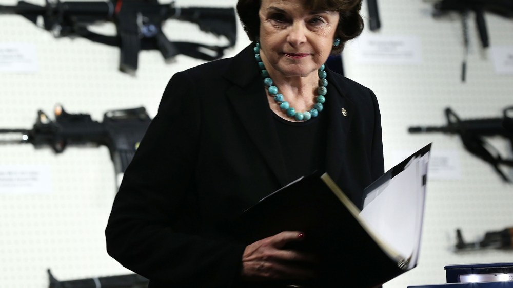 U.S. Sen. Dianne Feinstein (D-CA) stands next to a display of assault weapons during a news conference January 24, 2013 on Capitol Hill in Washington, DC. Feinstein sponsored a bill to ban assault weapons and high-capacity magazines capable of holding...