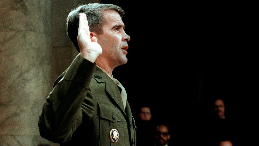 Lieutenant-Colonel Oliver North is sworn in July 7, 1987 before the House and Senate Foreign Affairs Committee hearing in Washington, D.C. on arms sales to Iran and diversion of profits to Nicaraguan Contra rebels.