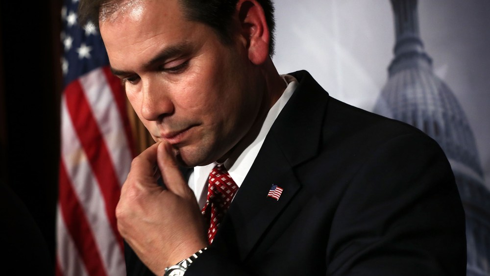 File Photo: U.S. Sen. Marco Rubio (R-FL) listens during a news conference on a comprehensive immigration reform framework January 28, 2013 on Capitol Hill in Washington, DC.  (Photo by Alex Wong/Getty Images, File)