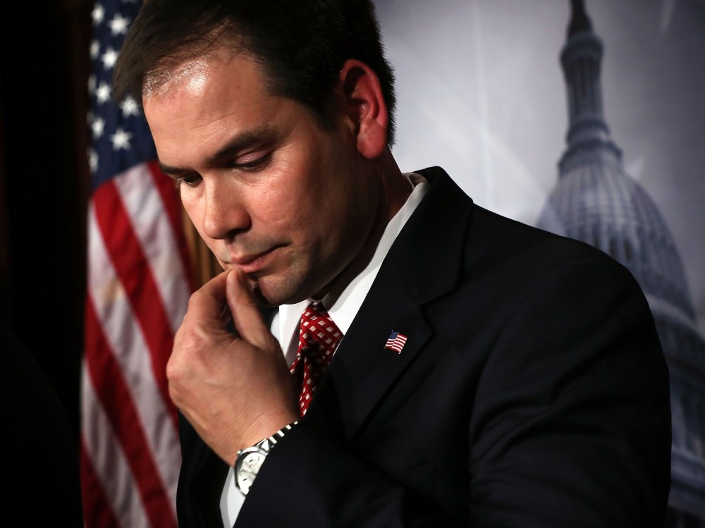 File Photo: U.S. Sen. Marco Rubio (R-FL) listens during a news conference on a comprehensive immigration reform framework January 28, 2013 on Capitol Hill in Washington, DC. (Photo by Alex Wong/Getty Images, File)