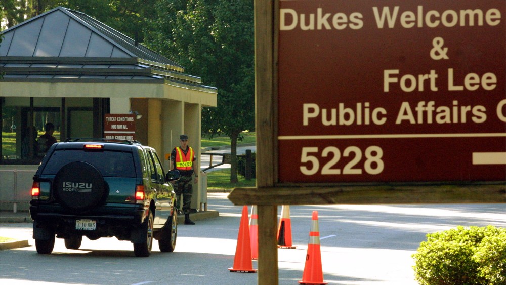 Military personnel guard the entrance to Fort Lee Military Base.