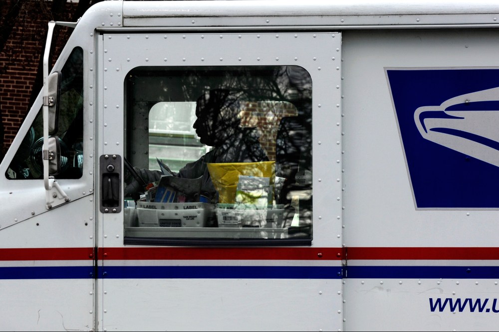 Postal carrier Anthony White sits in his truck while making his rounds in Kensington, Md. on Feb. 6, 2013.