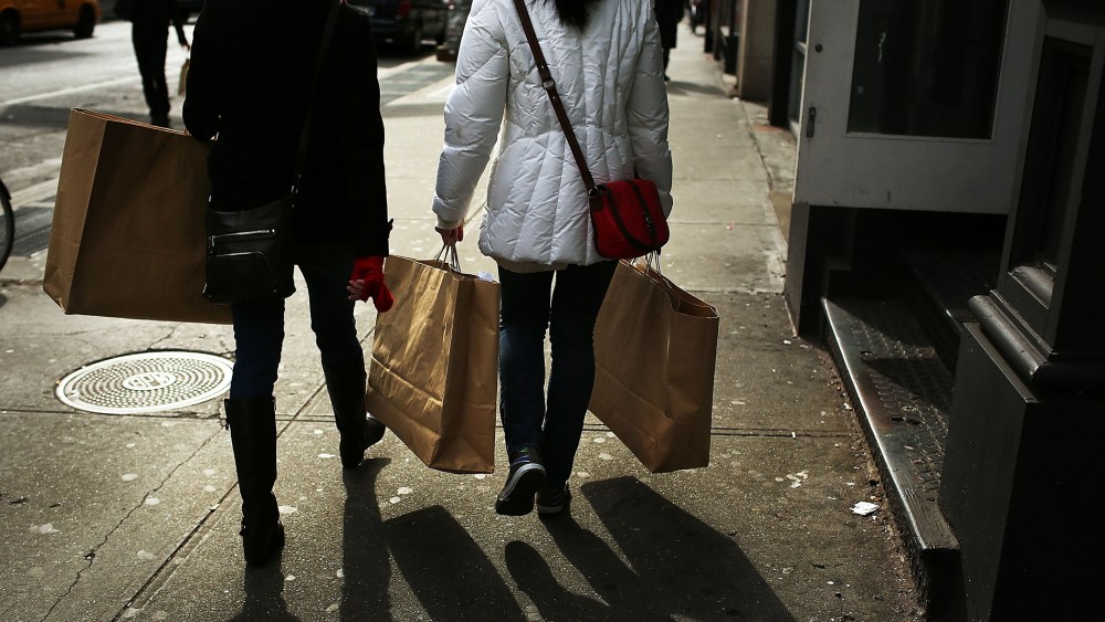 Women walk down Broadway with shopping bags on Feb. 7, 2013 in New York, N.Y. (Photo by Spencer Platt/Getty)