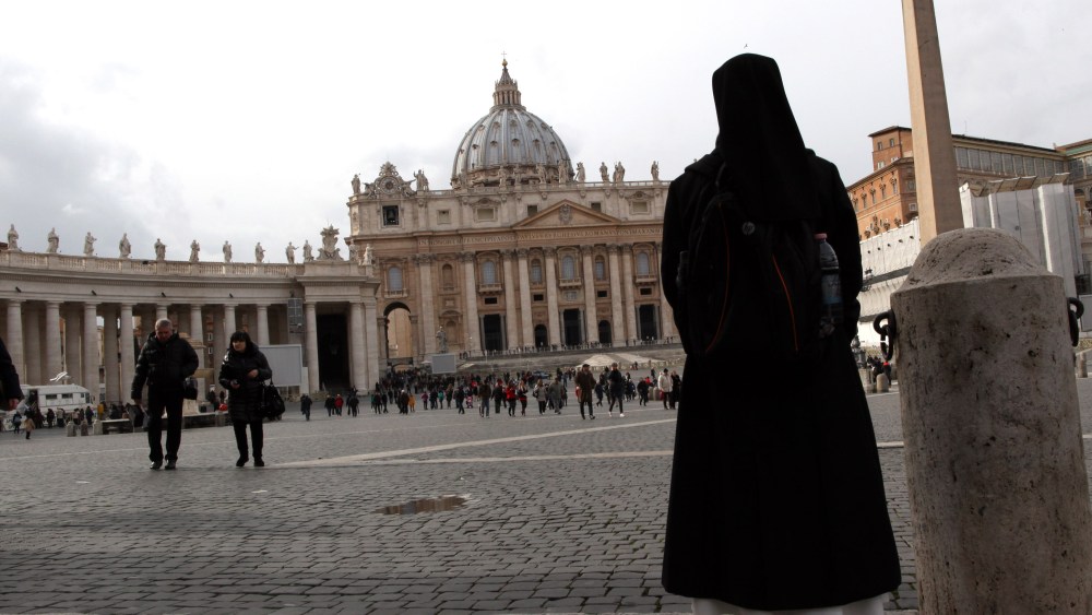 A nun walks in St. Peter's Square on February 11, 2013 in Vatican City, Vatican. Pope Benedict XVI today announced that he is to retire on February 28 citing age related health reasons. (Photo by Franco Origlia/Getty Images)