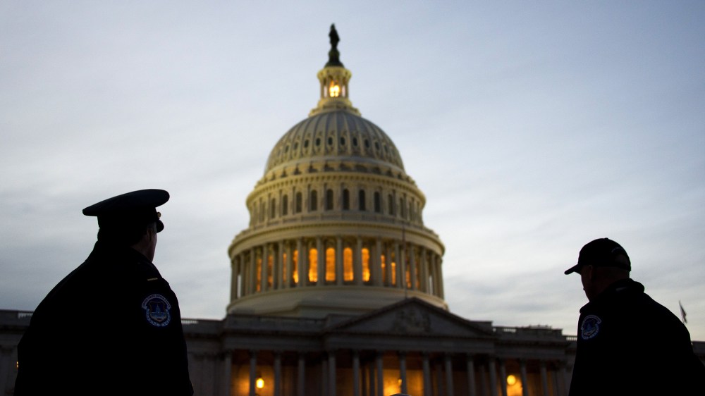 US Capitol Police stand guard in front of the US Capitol in Washington, DC, Feb. 12, 2013. (Photo by Jim Watson/AFP/Getty)