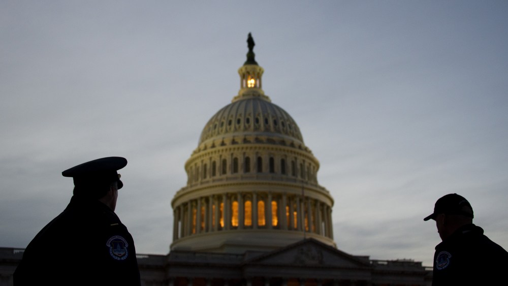 U.S. Capitol Police stand guard in front of the U.S. Capitol in Washington, D.C. (Photo by Jim Watson/AFP/Getty)
