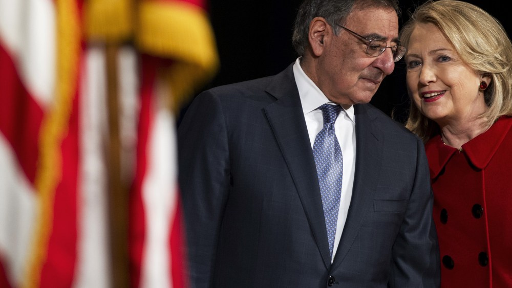 Leon Panetta Hillary Clinton speak prior to Clinton receiving the Department of Defense Medal for Distinguished Public Service during a ceremony at the Pentagon in Washington, DC on Feb. 14, 2013