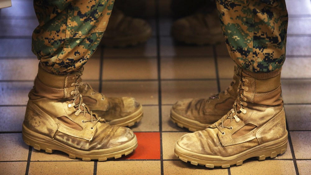 Marine recruits sit while having lunch during boot camp on February 26, 2013 at MCRD Parris Island, South Carolina.