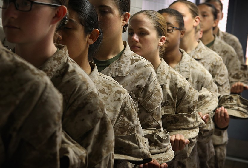 Female Marine recruits stand in line before getting lunch in the chow hall during boot camp on February 26, 2013 at MCRD Parris Island, South Carolina.   (Photo by Scott Olson/Getty Images)