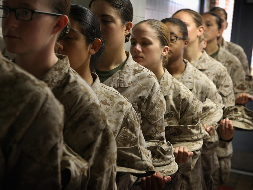 Female Marine recruits stand in line before getting lunch in the chow hall during boot camp on February 26, 2013 at MCRD Parris Island, South Carolina. (Photo by Scott Olson/Getty Images)
