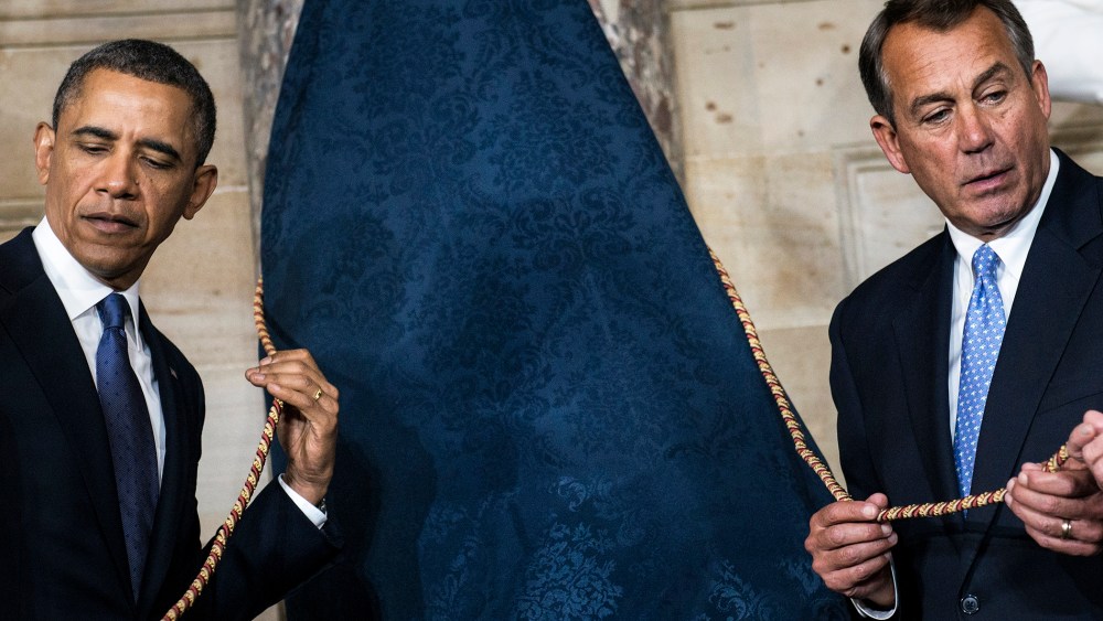 President Barack Obama (L) and Speaker of the House John Boehner (R-OH) wait to unveil a statue of Rosa Parks during an unveiling in Statuary Hall on Capitol Hill, Feb. 27, 2013 in Washington, D.C.
