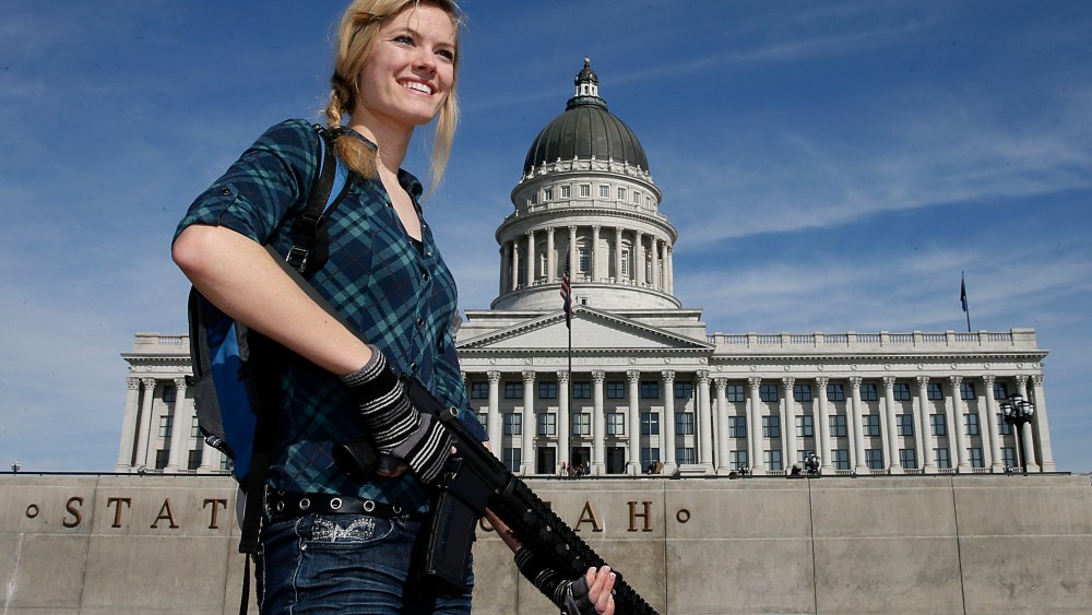 Darci Lund carries an AR-15 at a gun rights rally and march at the Utah State Capitol on March 2, 2013 in Salt Lake City, Utah. The rally attracted several hundred people for the march to the Utah Capitol in favor of 2nd Amendment rights as gun control...