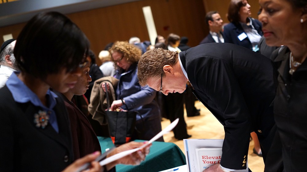 Job seekers speak to representatives of employers at a job fair at the Jewish Community Center in Manhattan on March 6, 2013 in New York, N.Y.