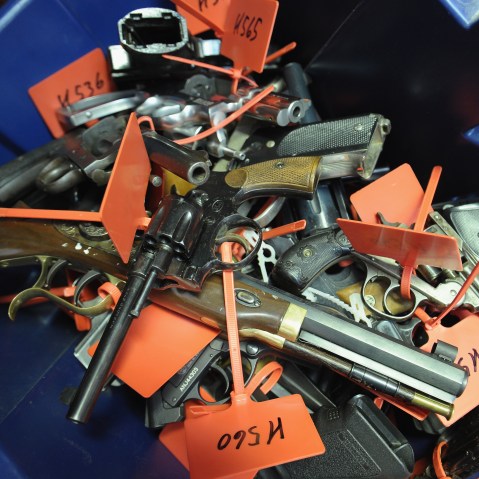 Tagged handguns lay in a bucket during a gun buyback program on March 9, 2013 in Keansburg, New Jersey.  (Photo by Michael Loccisano/Getty Images)